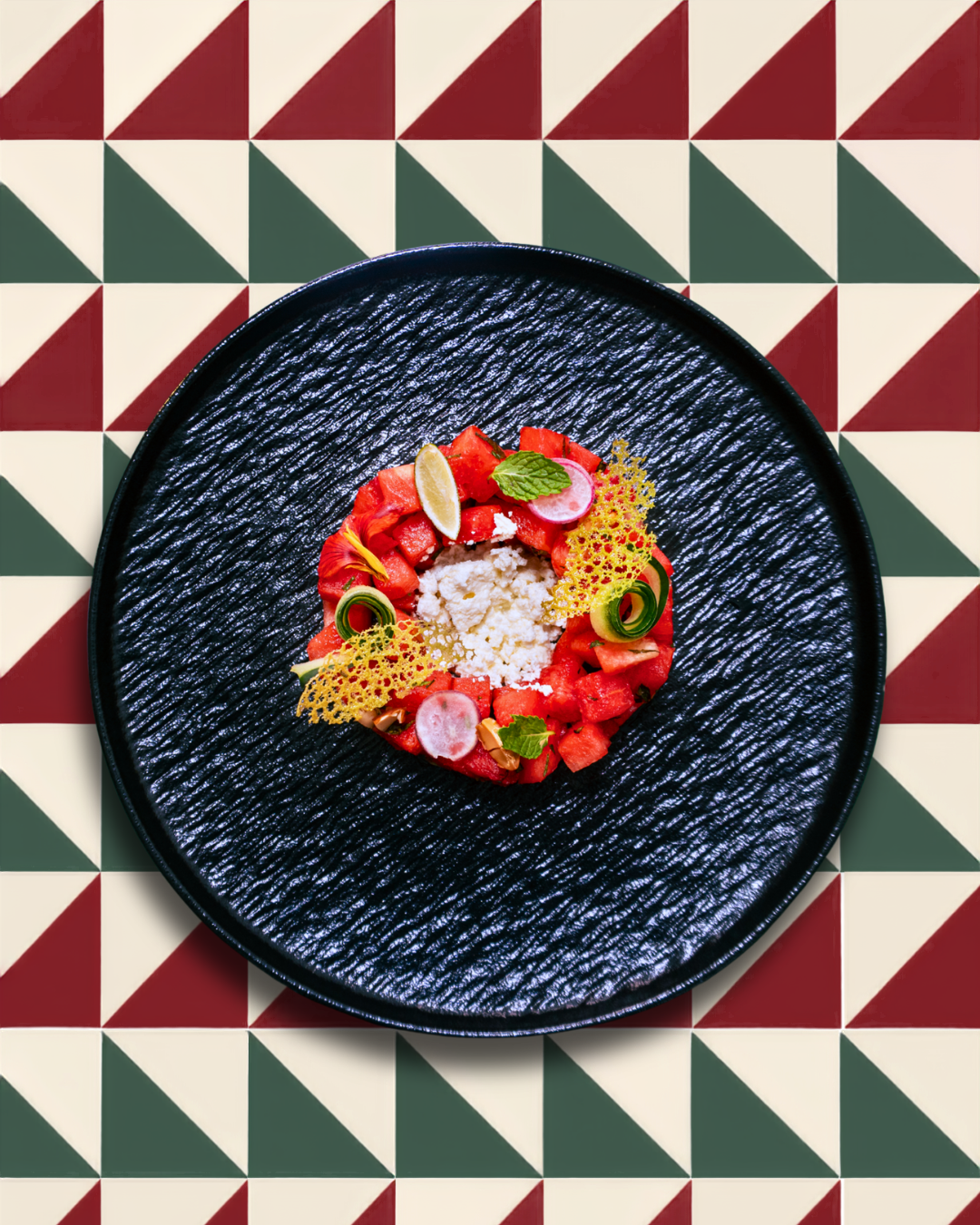 Watermelon salad presented on Mezcal's graphic tile surface