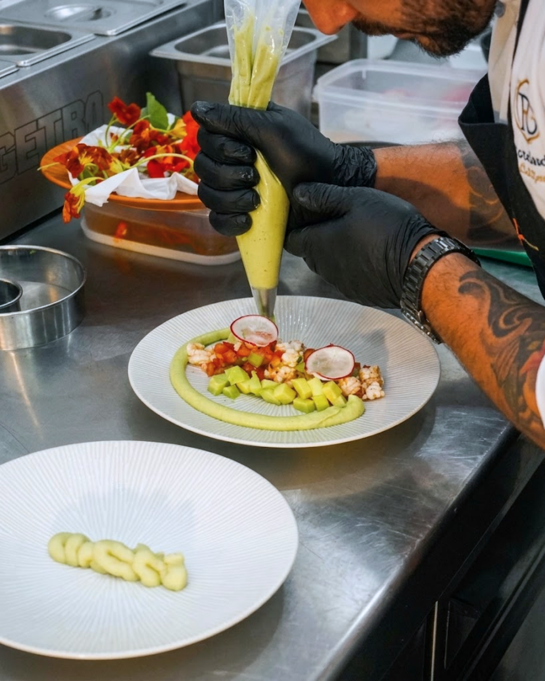 Mezcal chef plating a dish in the kitchen